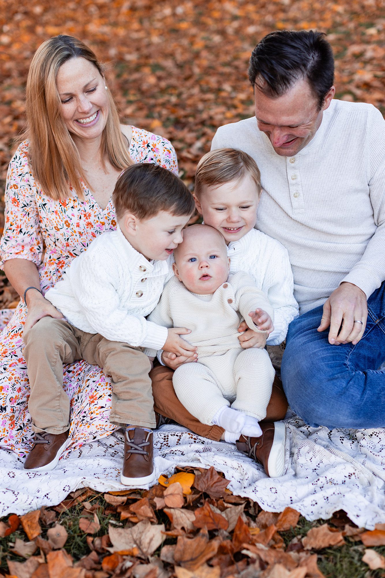 Boston Fall Family Photos - big brothers hugging baby