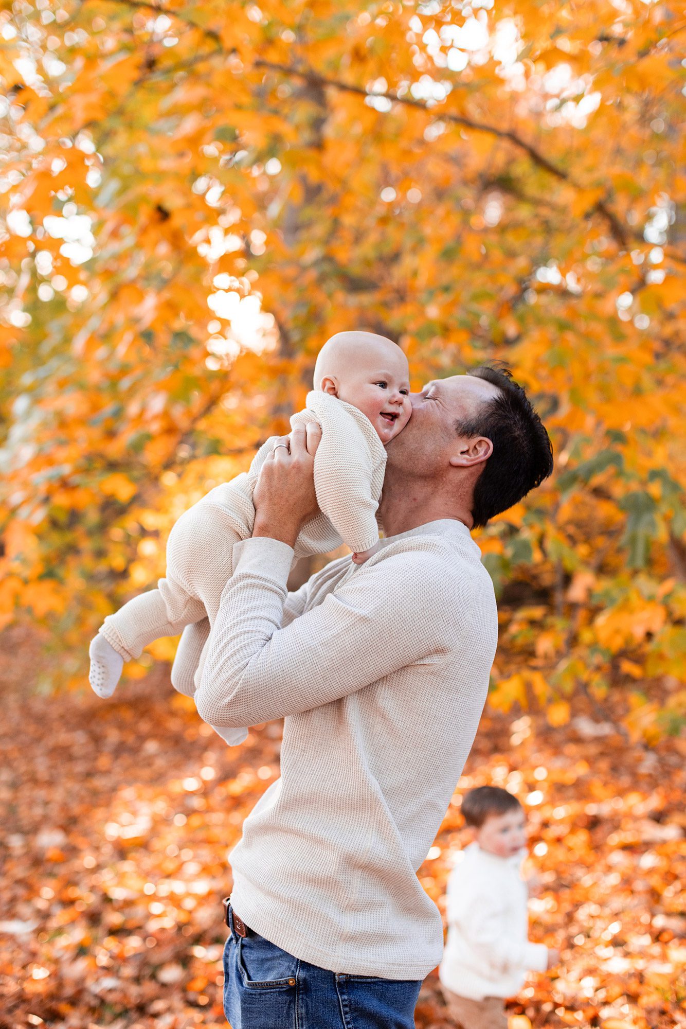 Boston Fall Family Photos - dad kissing baby's cheek