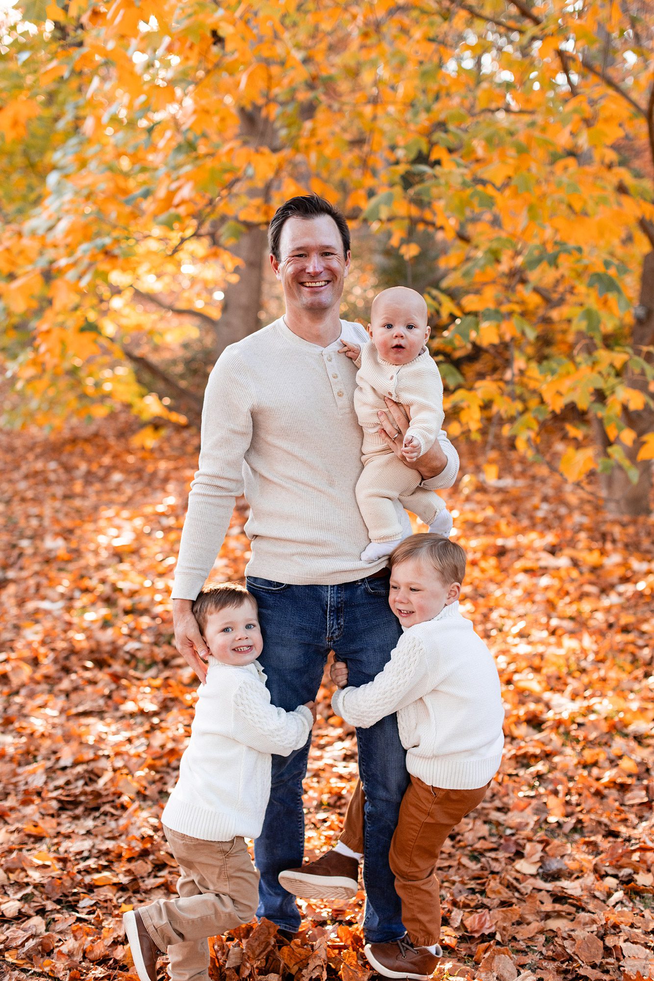 Boston Fall Family Photos - dad and 3 boys in cream sweaters