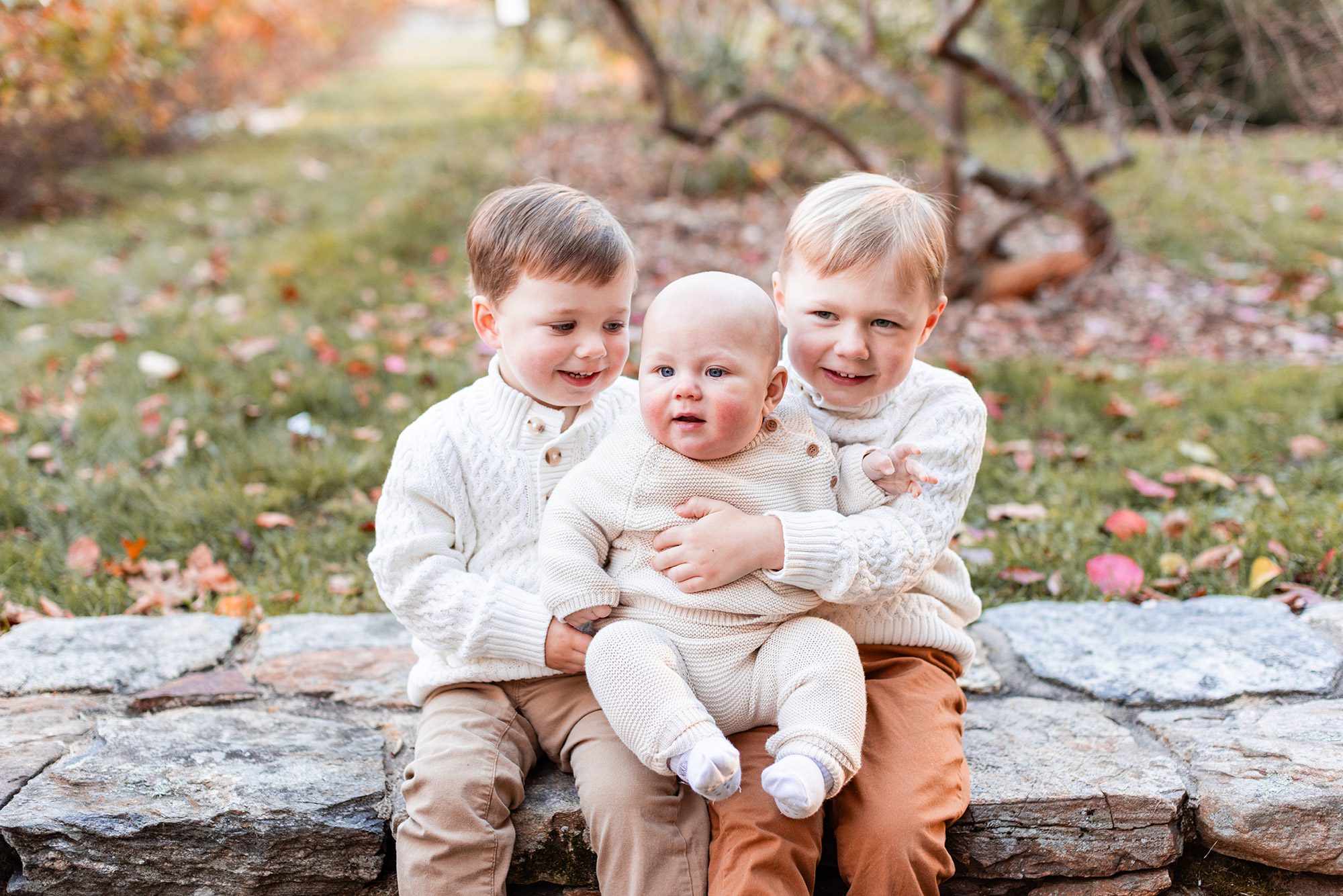Boston Fall Family Photos - big kids holding their baby