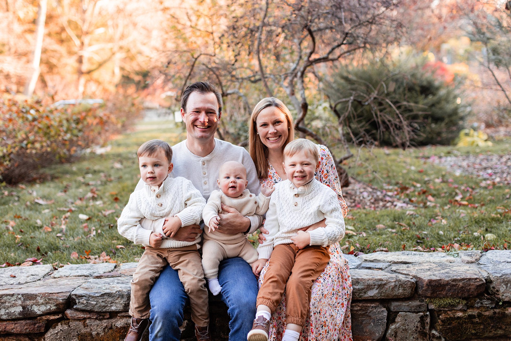 Boston Fall Family Photos - family of 5 sitting on a stone wall