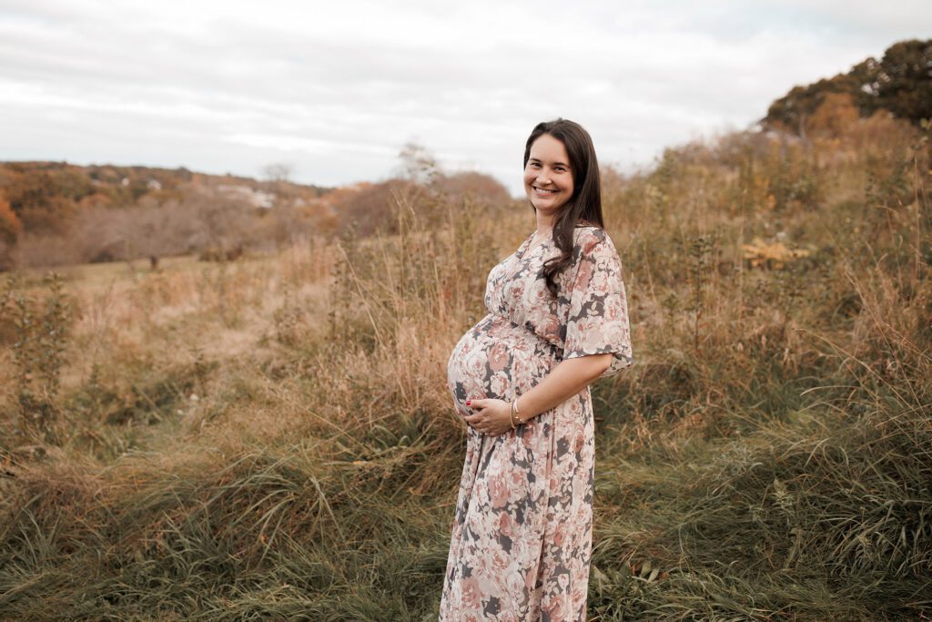 what to wear for your maternity photo session - pretty floral flowy dress perfect for a field