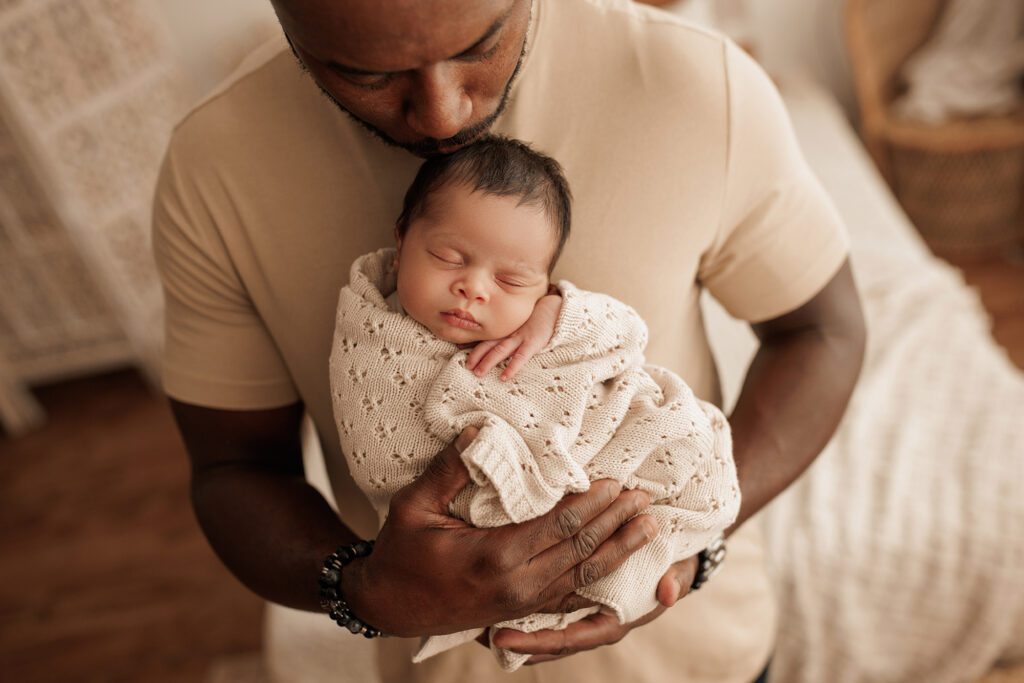 Best Newborn Photos of 2023 dad and baby