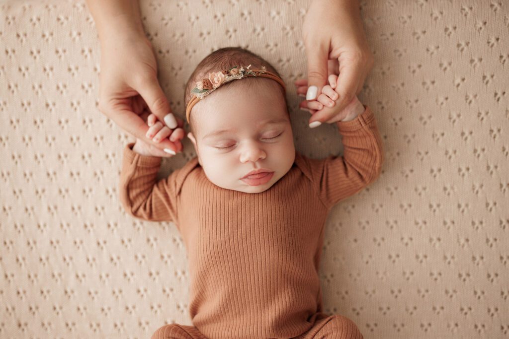 Best Newborn Photos of 2023 baby holding mom's hands