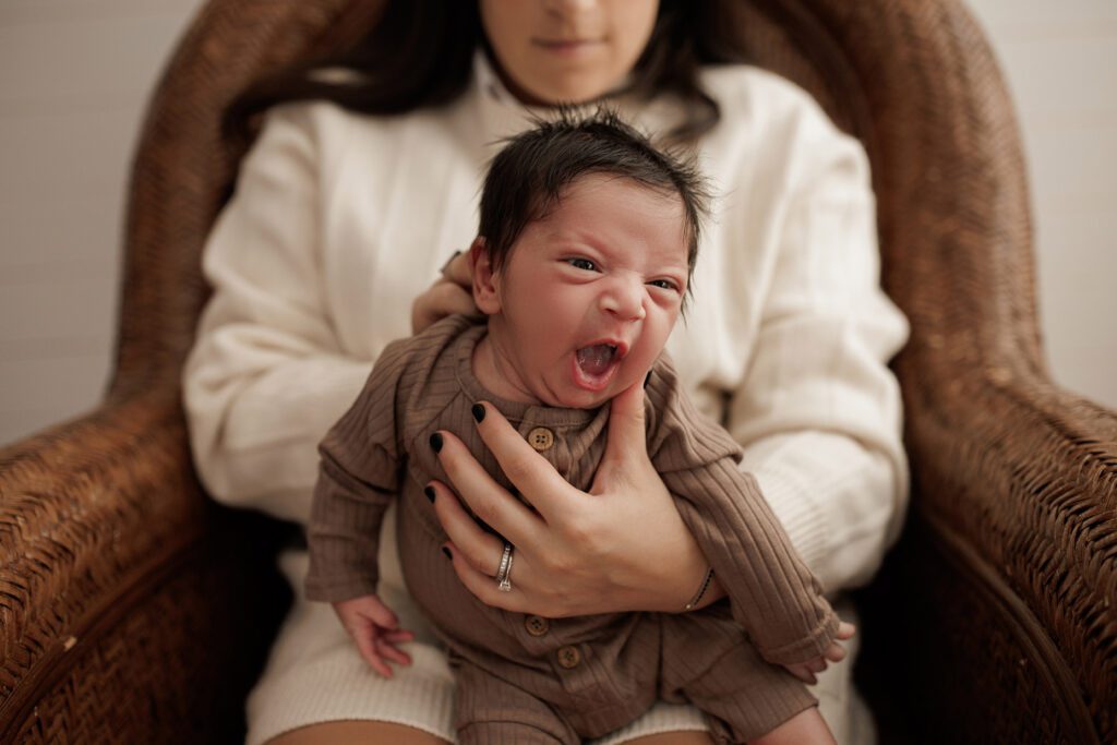 How to prepare for your newborn photo session burping baby