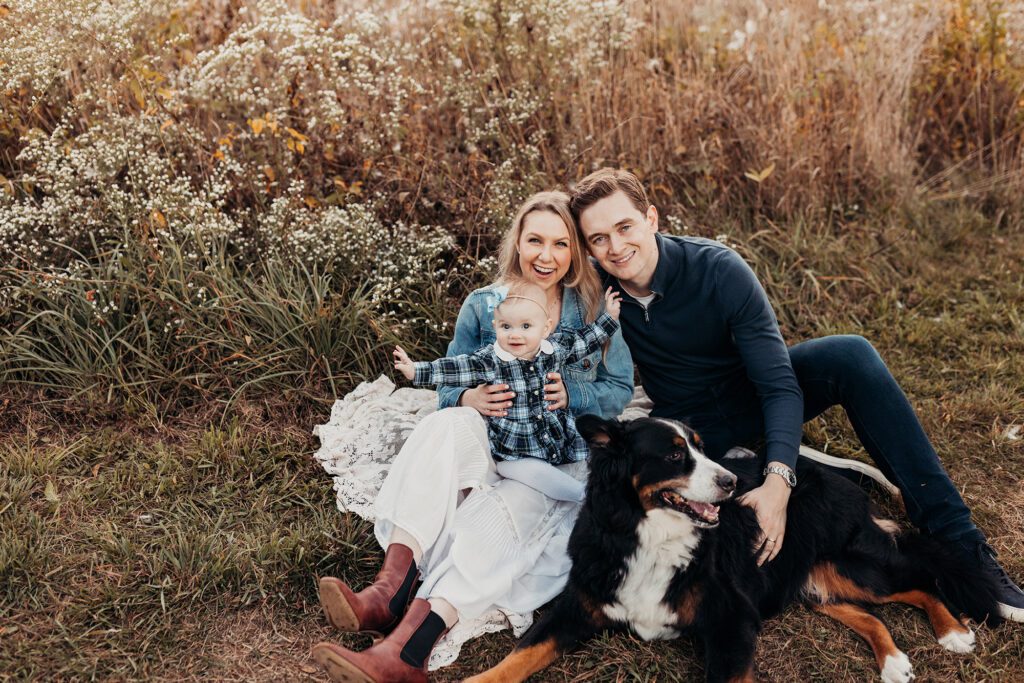 Kid friendly restaurants in roslindale - family with dog and baby sitting in a field