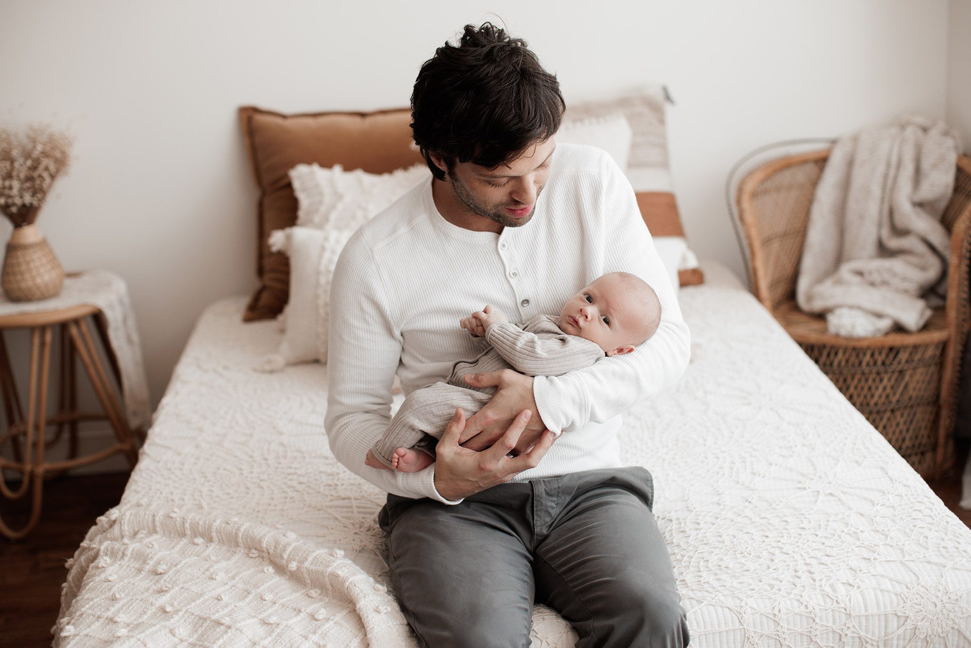 Family Photography with Newborn - dad rocking baby