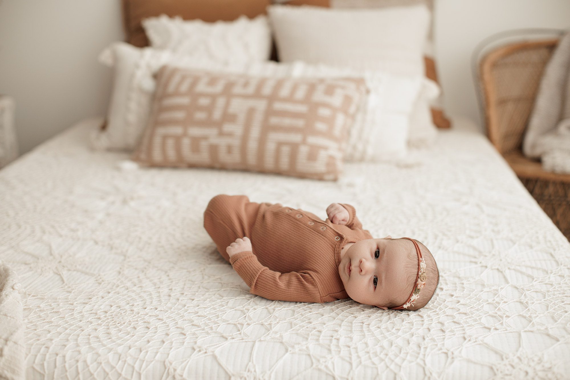 Favorite Newborn Photography Poses - baby laying on a bed