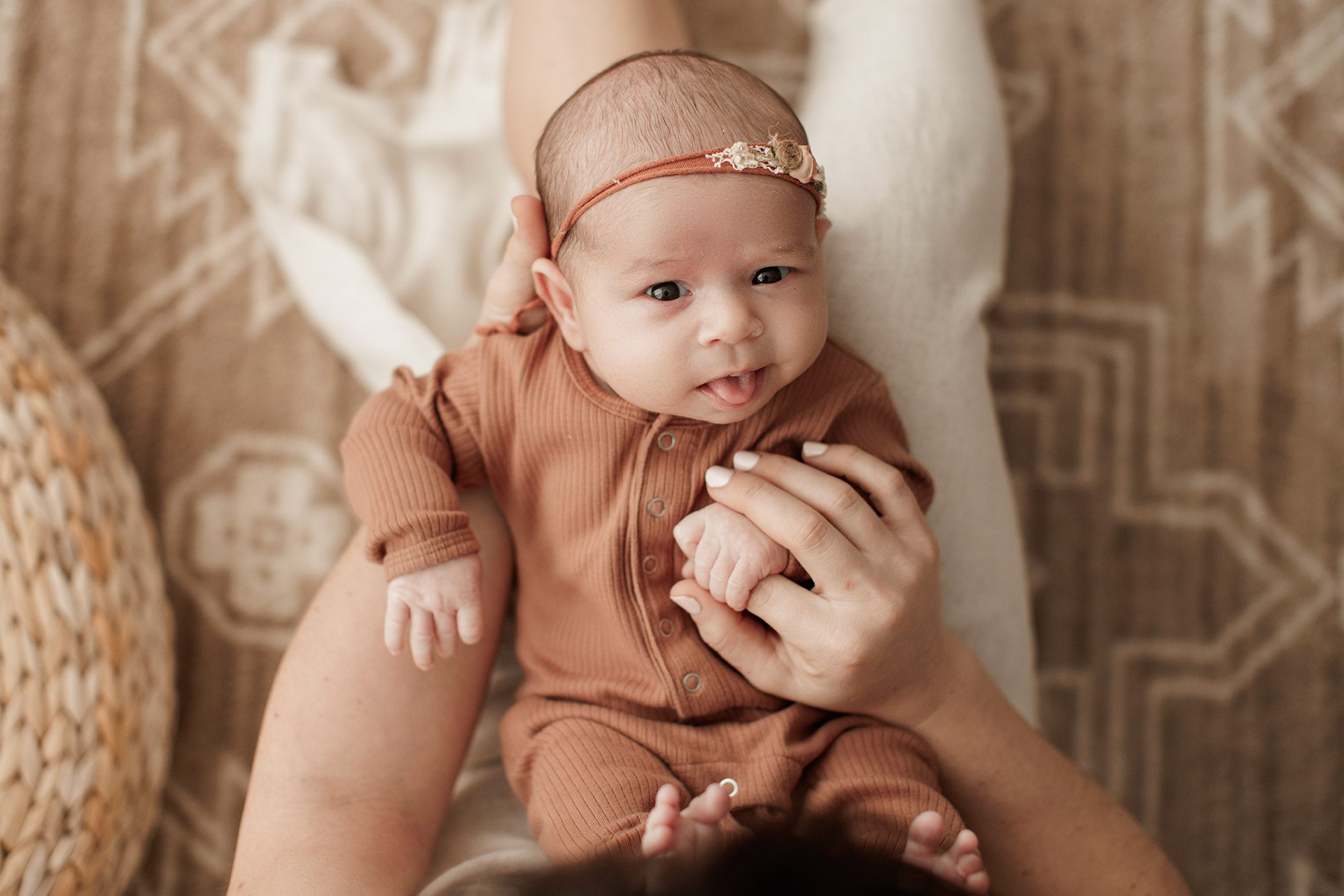 Favorite Newborn Photography Poses - baby sticking out her tongue