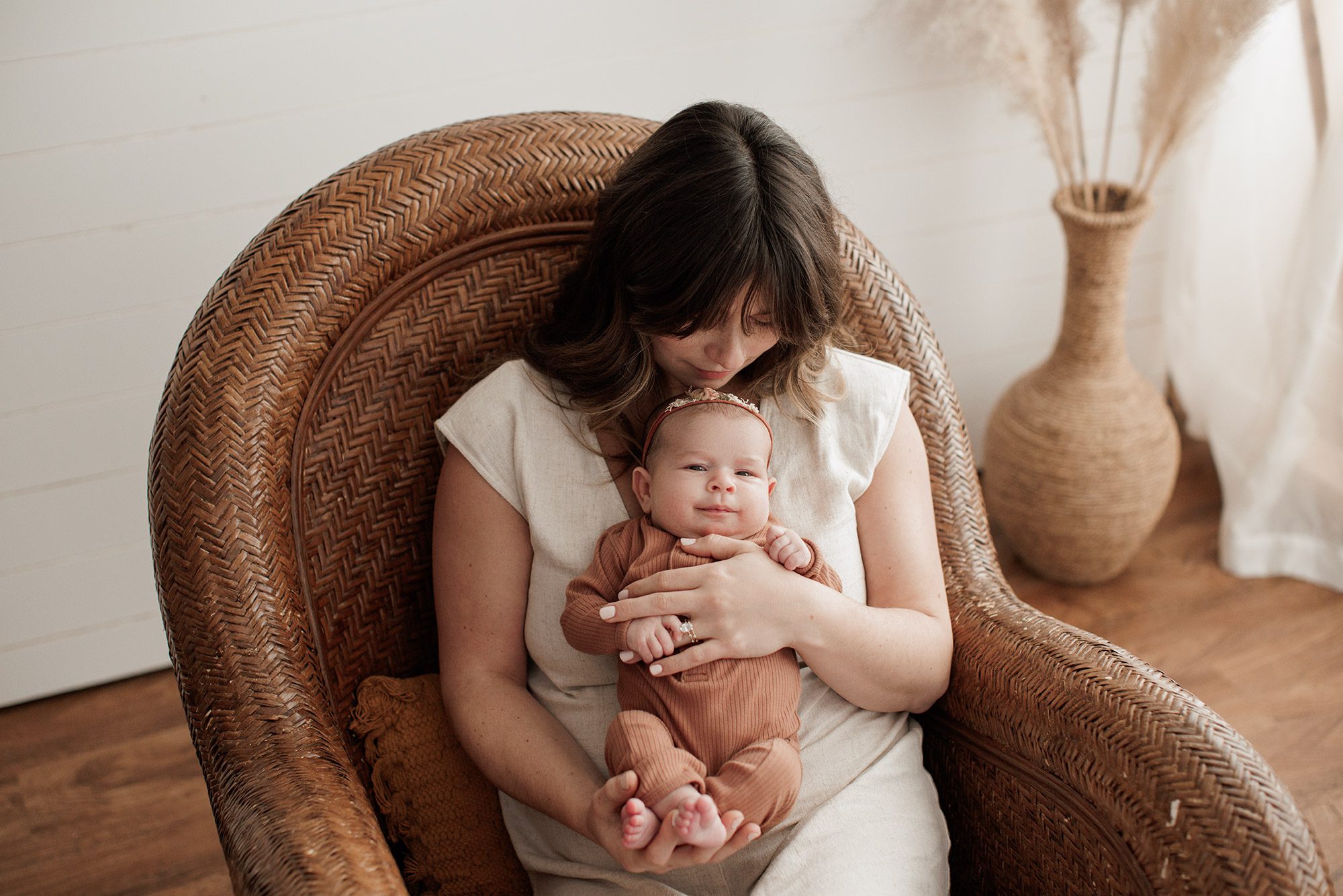 Favorite Newborn Photography Poses - mom in a chair