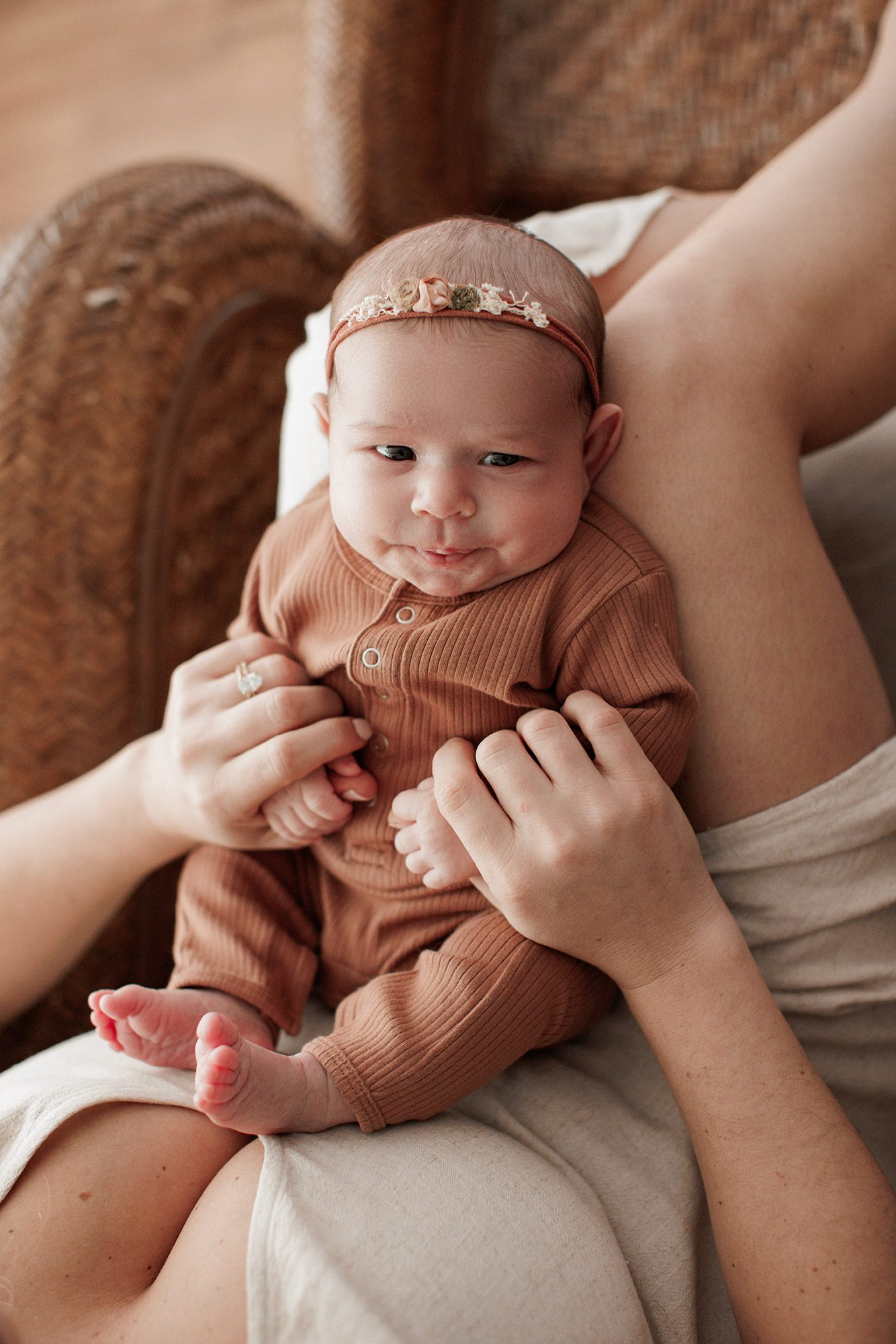 Favorite Newborn Photography Poses - baby laying in mom's lap