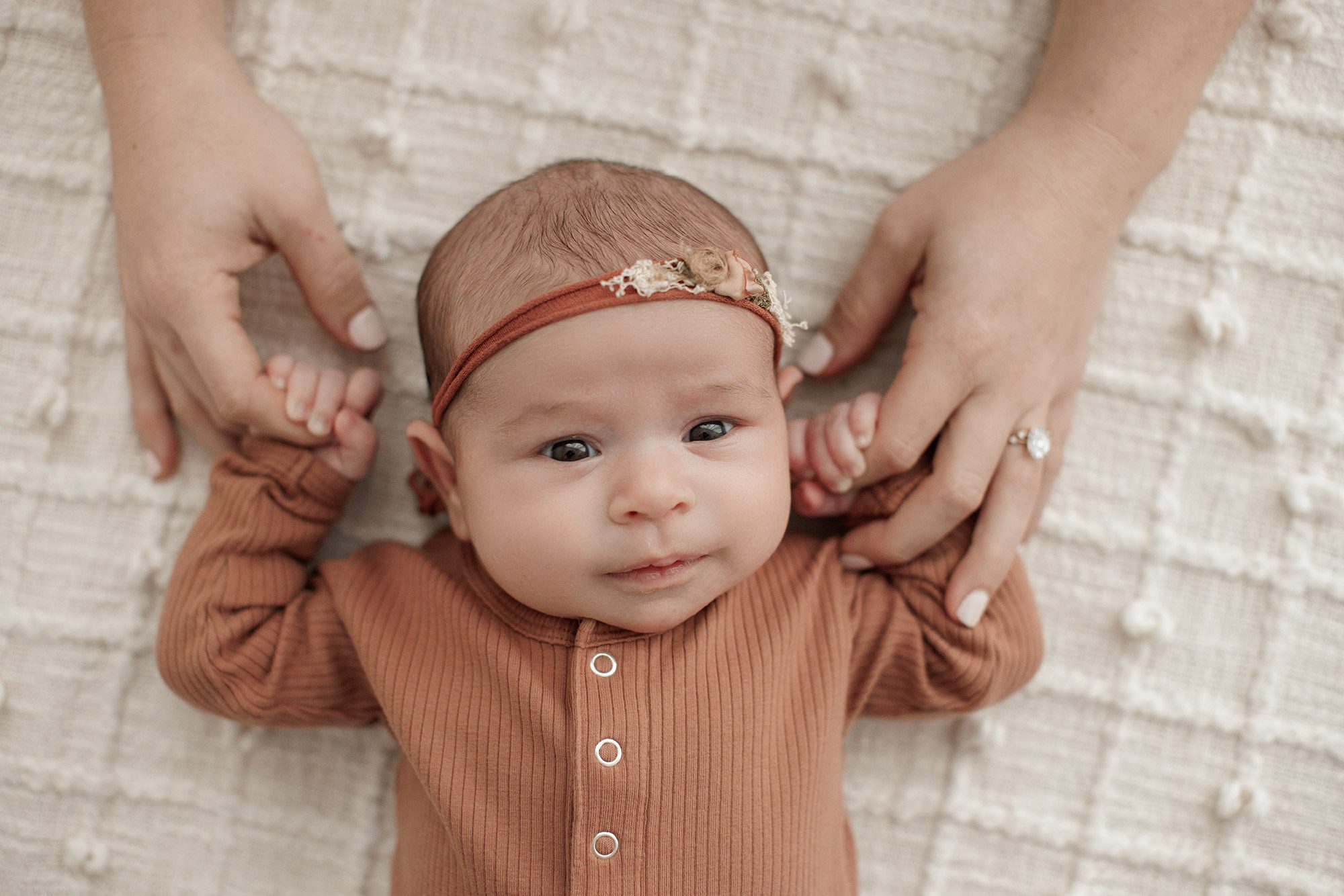 Favorite Newborn Photography Poses - baby girl holding mom's hands