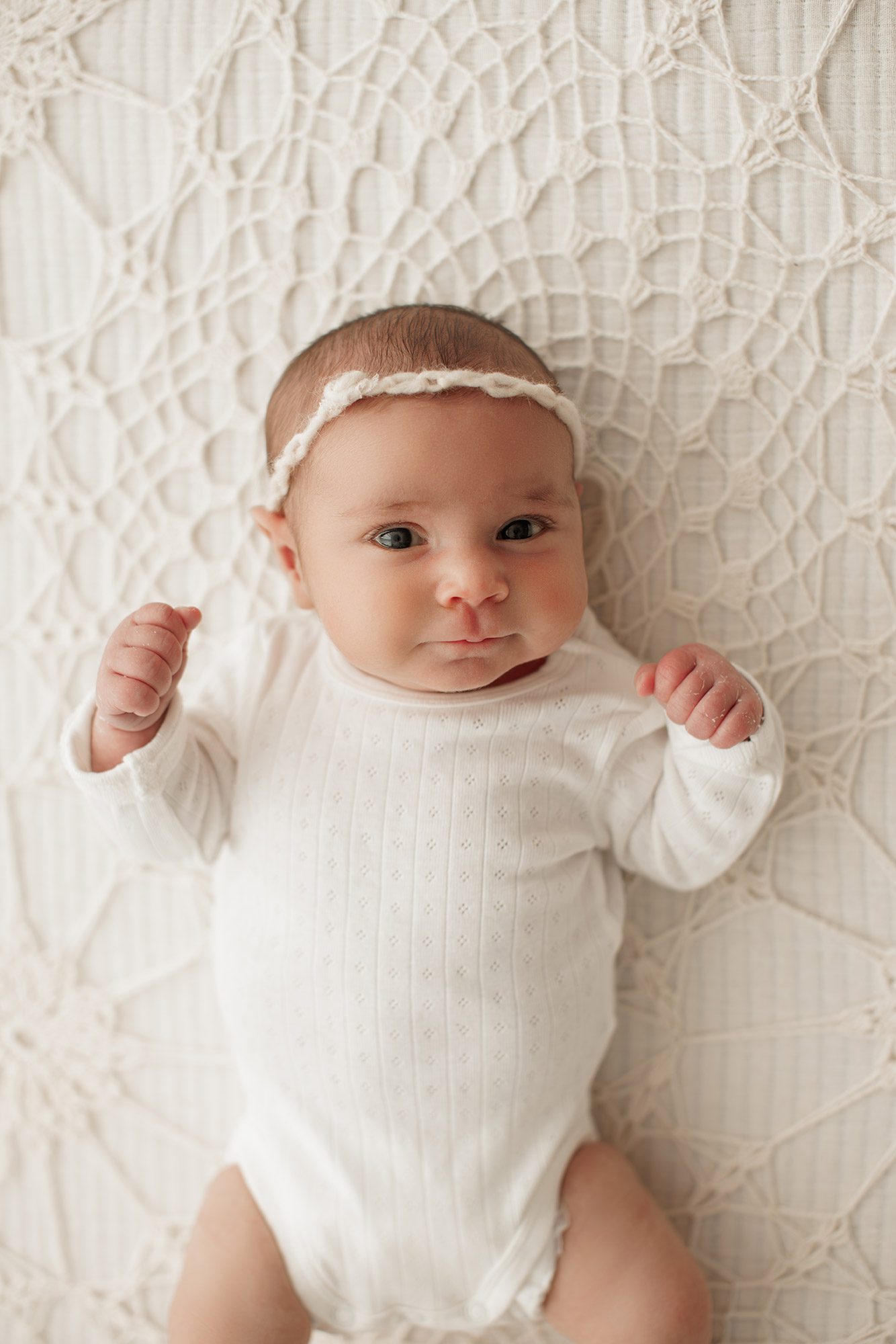 cozy minimalist newborn photoshoot Boston - smiling baby