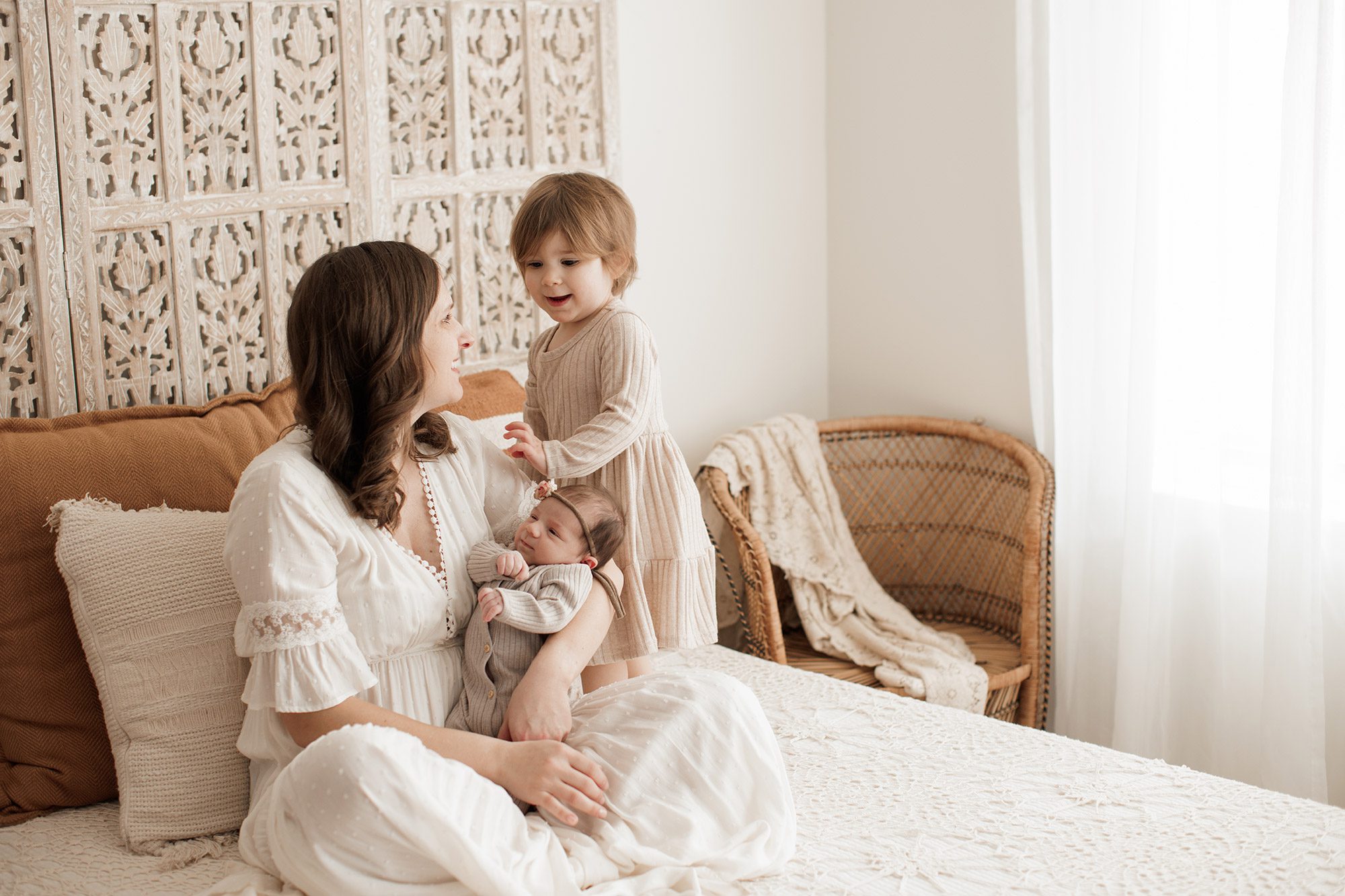 Best Location for a Newborn Photoshoot - mom with her two girls