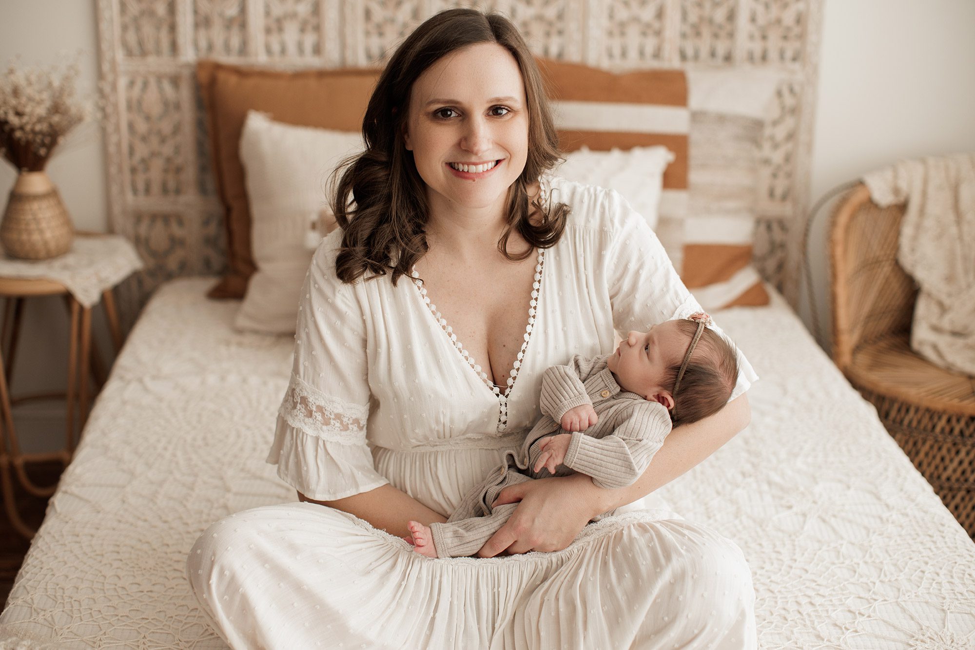Best Location for a Newborn Photoshoot - mom sitting with baby