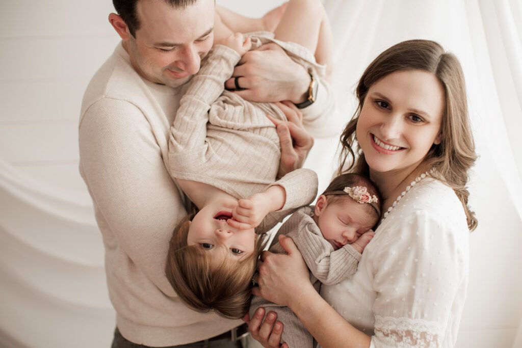 Best Location for a Newborn Photoshoot - family playing