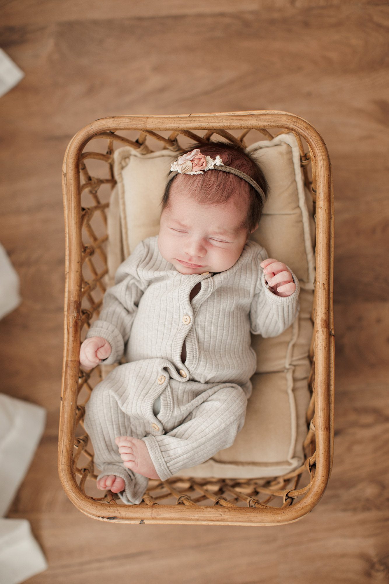 Best Location for a Newborn Photoshoot - baby girl laying in a basket