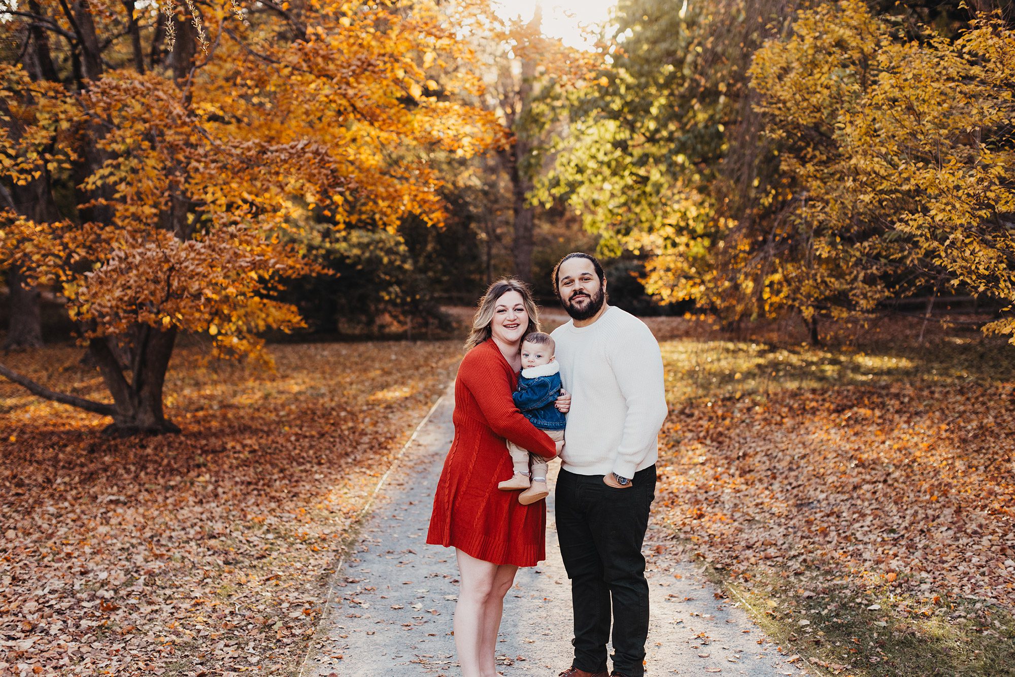 Annual Family Photos Boston Photographer - holding baby with fall leaves