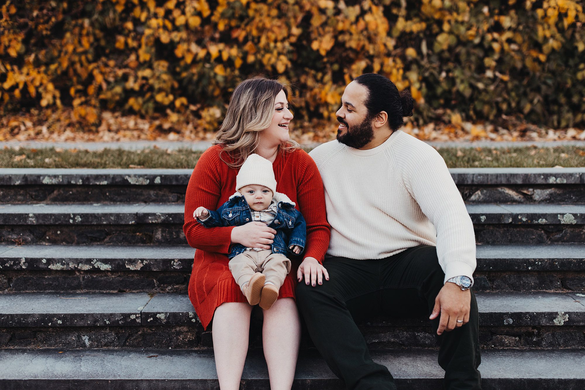 Annual Family Photos Boston Photographer - parents sitting on stairs at a park